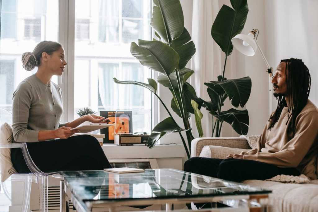 therapist talking to patient